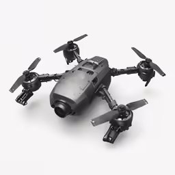 a small, grey plastic model that has propellers on the front and sides