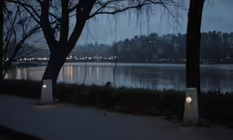 water view from sidewalk with lit candles lite at night