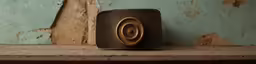 a close - up of an old, worn, rusty speaker