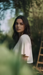 a woman wearing white dress with long hair and eyes
