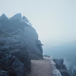 fog and heavy rain over a pathway leading up the mountain