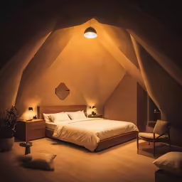 a bedroom with a large bed and a couch in it
