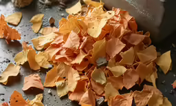 this is a pile of orange and yellow leaves