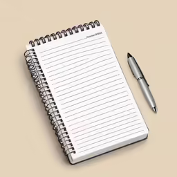 a notepad and a pen on a desk