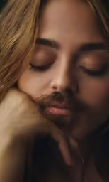 a young woman sleeping, with her eyes closed