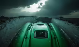 an old convertible parked in the middle of a freeway
