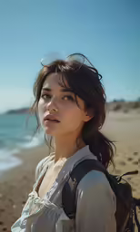 a woman with long hair looks into the distance