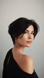 the woman is posing with her head tilted