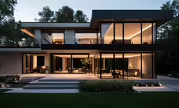 the view of a large home from across a lawn area
