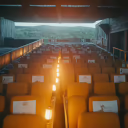 seats lined up with drinks lit in the middle