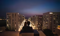 a couple of people that are on a rooftop