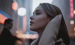 a woman posing for the camera in an urban setting