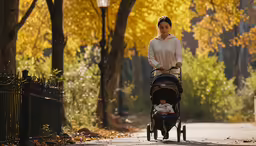 a woman pushing a stroller next to a little boy