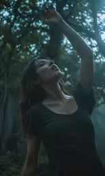 a woman is raising her hands into the air