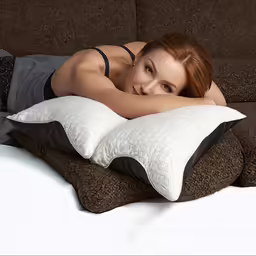 a beautiful woman laying down on top of a couch