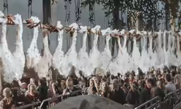 there is white cotton drying from a line