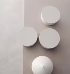 three circles, one with holes in the middle, the other with dots