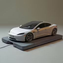 an electric car with its hood open sitting on top of a board