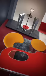 a modern living room with a red sofa and yellow chair