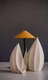 a table lamp that is shaped to look like large cones