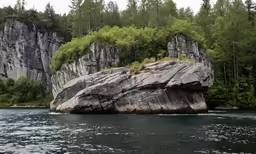 two rocks in a body of water