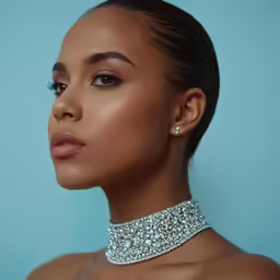 a woman wearing diamond collars on top of her chest