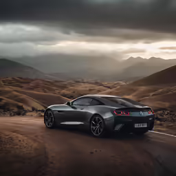 the new jaguar sports car is parked on a gravel road