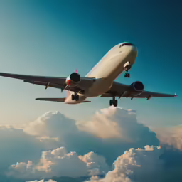 an airplane is flying in the air above the clouds
