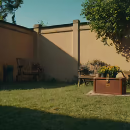 a wooden box sits near a brown bench