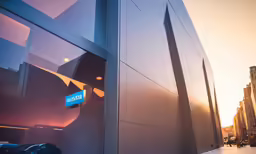 there is a large building on the side with some blue street signs