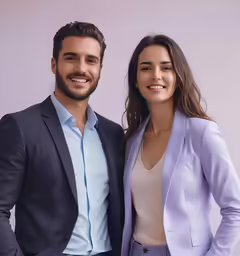 a man and woman smile as they stand together