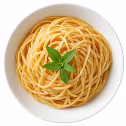 a white bowl filled with spaghetti and topped with a green leaf