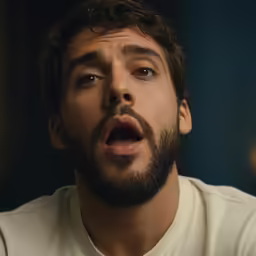 a man looking surprised with his mouth open