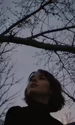 a woman is looking up with no one around