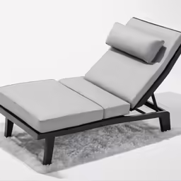a single seat lounger with two pillows