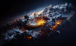 a fire burns in the background, with small amounts of snow on top