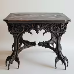 an antique desk with ornate design, including a top