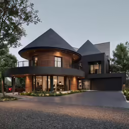 a large house with a spiral design at dusk