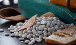 a close up of bread, candy, and grains on a counter