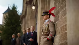 three men are standing outside looking at something