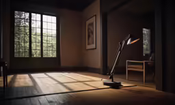 an old fashioned lamp on a hard wood floor