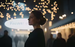 a woman looking up while in a shopping center