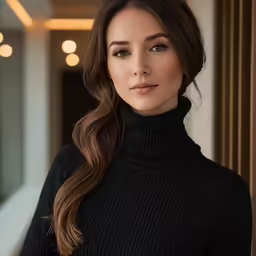 a woman wearing a black turtle neck sweater