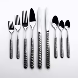 five forks, four knives, a spoon and several knives