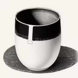 a coffee cup is sitting on a plate
