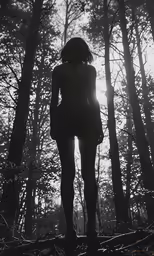 an eerie picture of a young woman in the woods