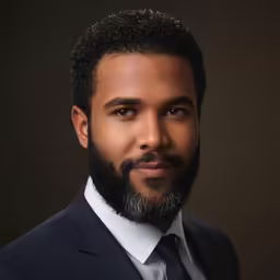 the man in the suit has a beard