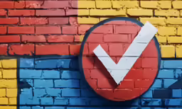 a check mark on a brick wall with paint