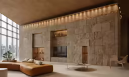 modern living room with high ceilings, large stone walls and leather couch