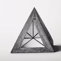 a triangular object on a white background